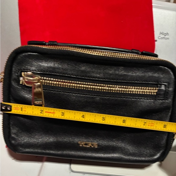 Tumi crossbody bag.
Length is 8.5 inches 
Height is 5.5 inches - Picture 13 of 15